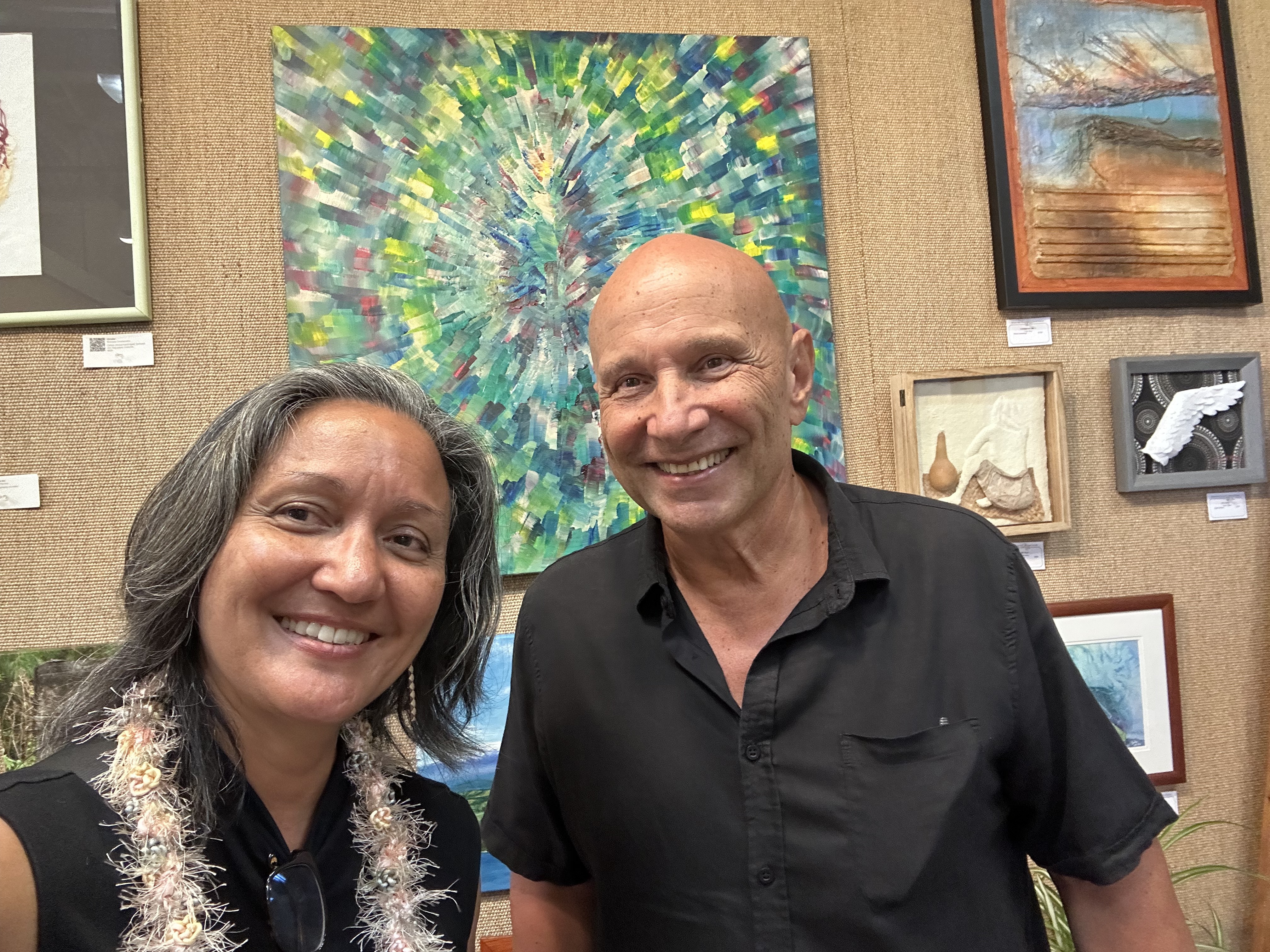 Sasha Chichagov with juror Lisa Solomine near the painting Confluence